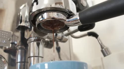Espresso Machine Brewing Dark Coffee in the Morning