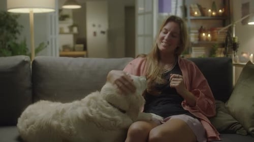 Woman Relaxing with her Dog on the Couch