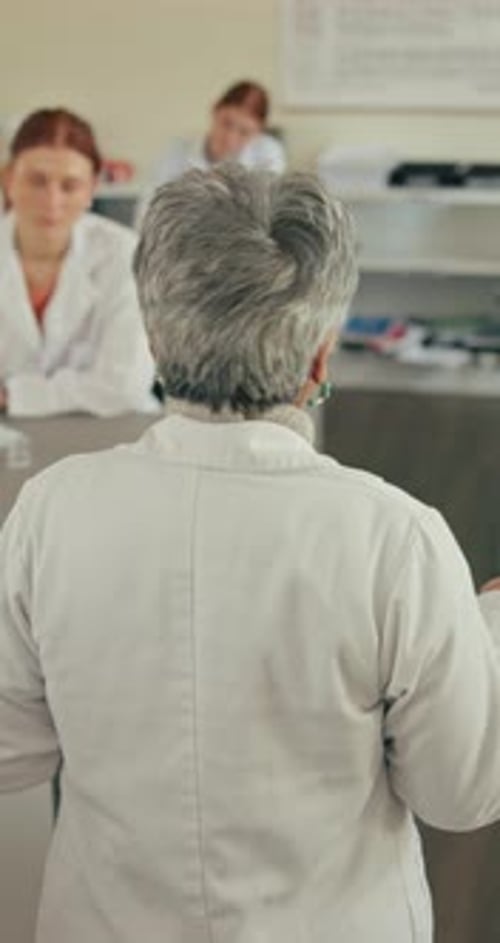 Back, education and walking with university teacher in science class for knowledge, lesson or study