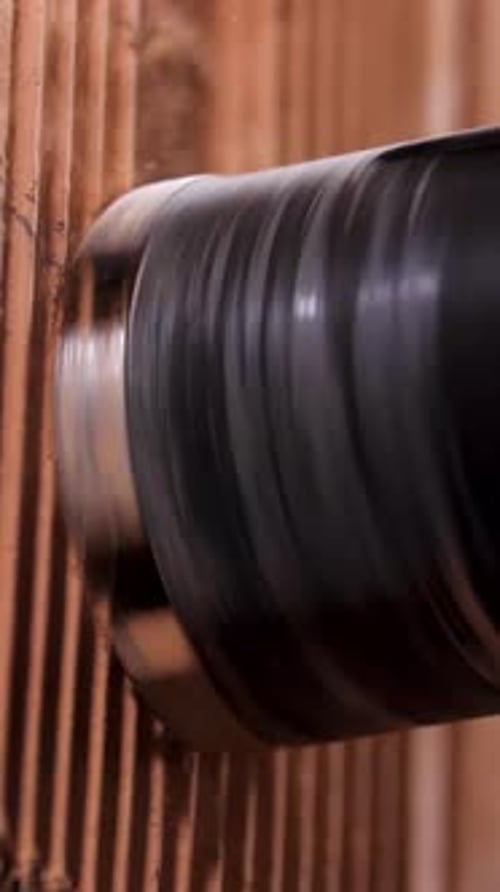 Drill bit bores into brick wall