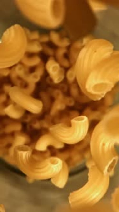 Super Slow Motion Dry Macaroni Pasta Filmed on a Highspeed Camera at 1000 Fps