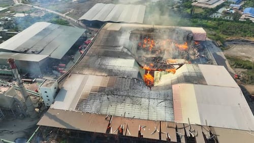 An industrial facility fire from above.