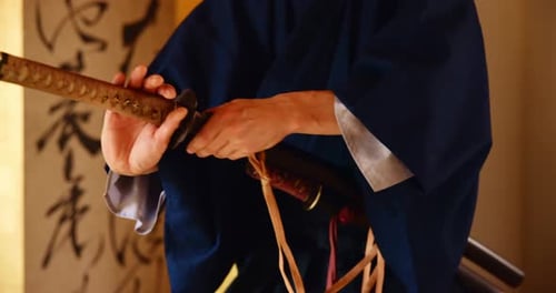 Samurai Sword Drawn by Person in Kimono