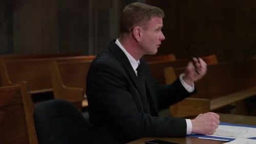 Lawyers in court room - pan to reveal- legal scene