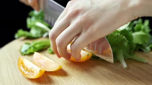 Bright Salad Ingredients Being Chopped on Cutting Board