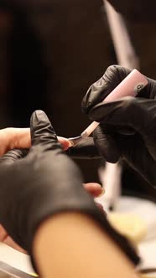 Applying nail polish in a salon setting