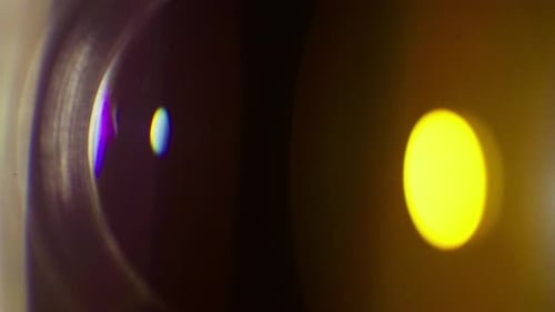Bright Yellow Flare And Hazy Blue Orb