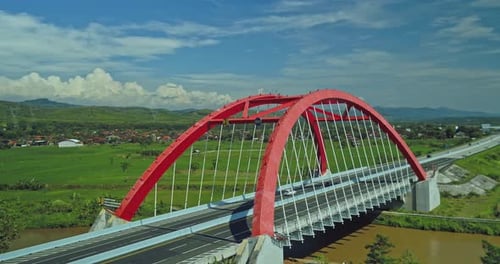Batang, 13 June 2022, Aerial view of long red toll road blue sky