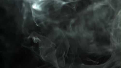 Abstract White Smoke Drifting on Dark Background