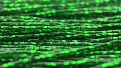 Lustrous Green Glass Beads in a Detailed Close-Up