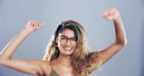 Enthusiastic Young Woman Dancing with Joyful Energy