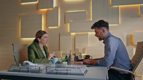 Team Discussing Technology in Modern Corporate Office