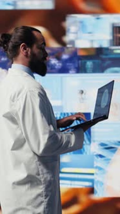 Medical Professional with Laptop in Tech Laboratory