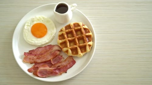 fried egg with bacon and waffle for breakfast
