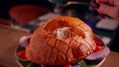 Delicious Bread Bowl Salad Preparation with Spoon
