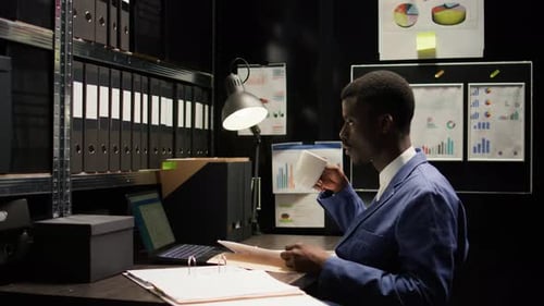 Police Officer Having Coffee in Office