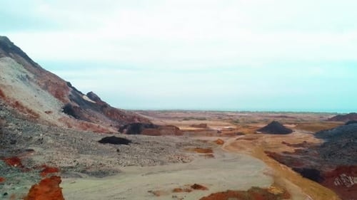 Aerial View of Colorful Volcanic Mountains and Rugged Landscape