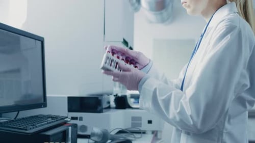 Scientist working with blood samples in laboratory