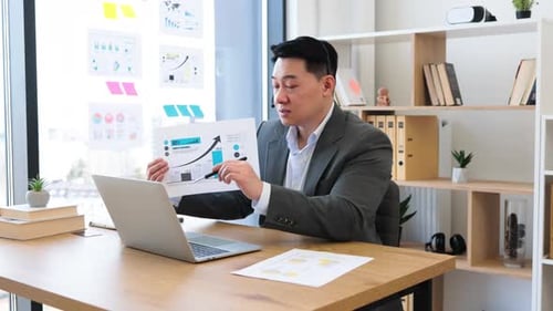 Professional Man Presenting Graph During Online Meeting