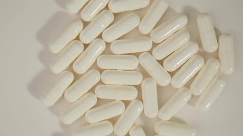 Pills and Vitamins Macro Close Up View of Womans Hands Holding Plenty of Different Drugs Painkillers