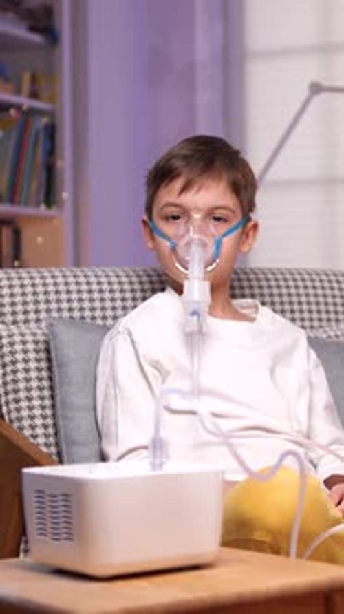 Child Using Nebulizer for Respiratory Treatment at Home