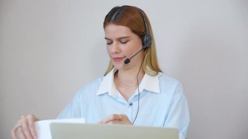 Professional young business woman working and meeting online in modern home office.