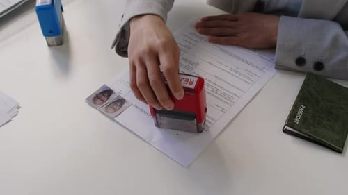 Visa Application Form Stamped Rejected in Office Setting