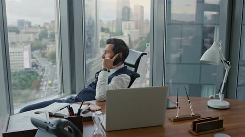 Busy Company Owner Talking Phone Sitting In Comfortable Office Chair. Confident Bearded Businessm...