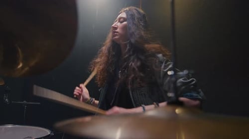 Woman Drummer Plays a Drum Kit Female Musician Beats a Rock Rhythm on Drums Girl Artist is