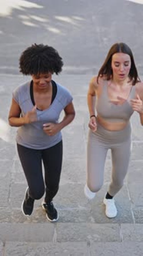 Women Running Up Stairs in Urban Exercise