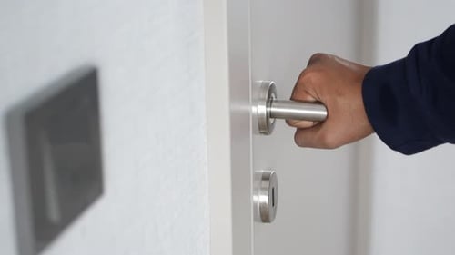 Man's Hand Opening Door Close Up
