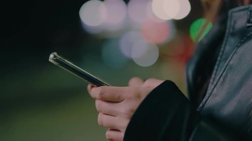 Online Shopping and Woman Texting on a Phone in an Urban City