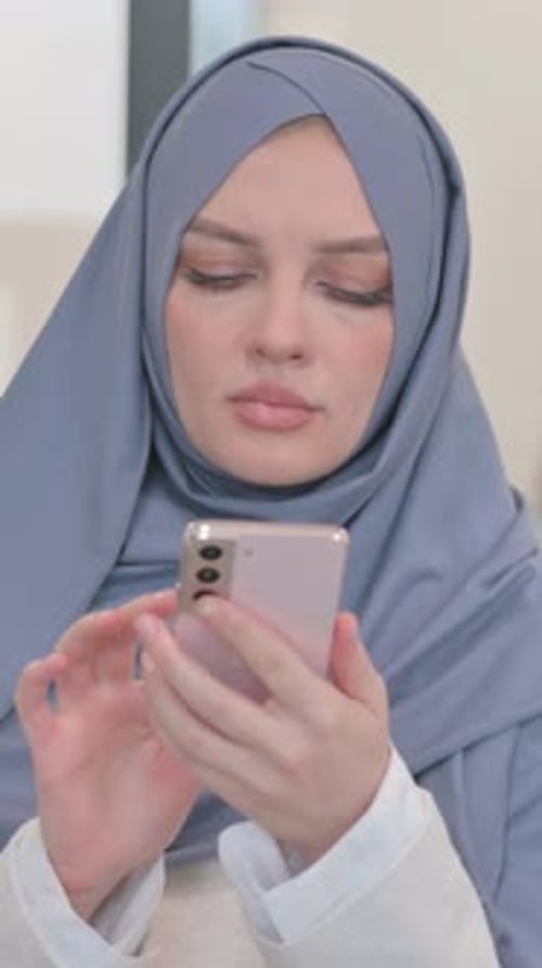 Portrait of Arab Woman Using Phone, vertical video