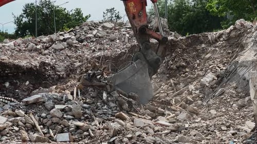 Bulldozer Removes Debris From A Collapsed House 1