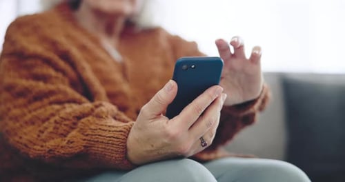 Cellphone, hand and closeup of senior woman scroll on social media, mobile app or the internet