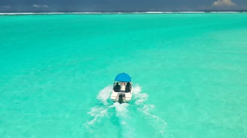 Aerial View of Tropical Island Beach Holiday Tourist Speed Boat on Blue Reef Ocean in Maldives