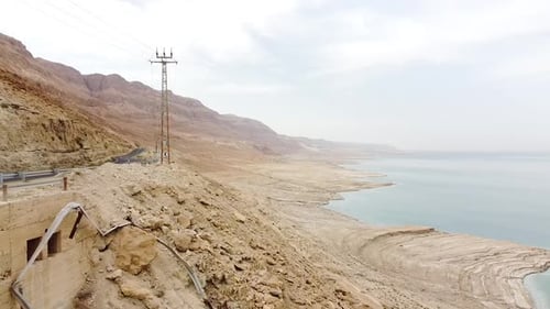 Aerial shot of salt formations in the Dead Sea, a drone flies over the lake - a view of the Dead Sea
