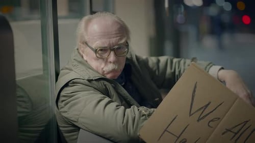 Elderly Homeless Man Suffering From Poverty Looking for Help at Train Station