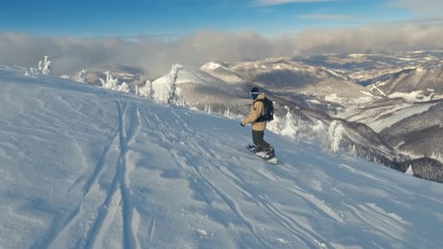 Snowboard Freeride in Frozen Winter Mountains Slow Motion of Snowboarder