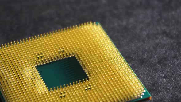 Central processing unit (CPU) outside computer, slow pan left, close up ...