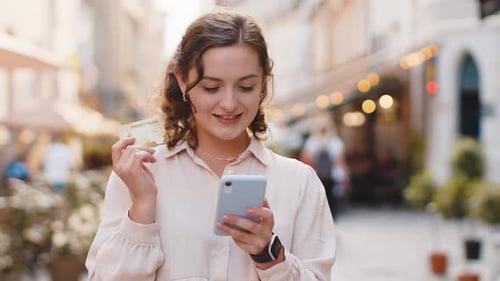 Young Woman Using Credit Bank Card Smartphone While Transferring Money Purchases Online Shopping