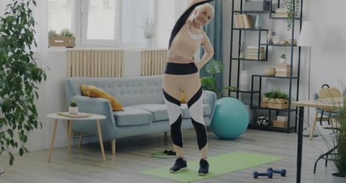 Senior Woman Stretching at Home