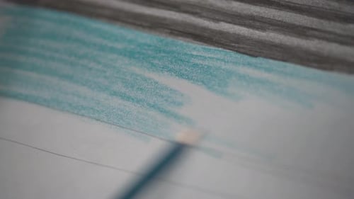 Drawing with colored pencils on paper