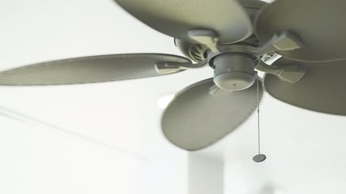 Rotating Ceiling Fan in Bright Interior Setting