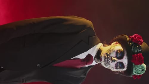 Man in Skull Makeup with Roses on Hat