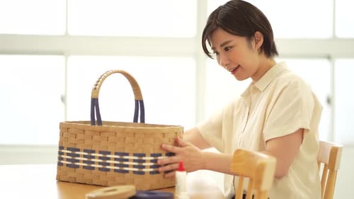 Young Woman Shows Off Her Handmade Woven Basket