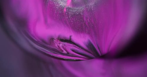 Swirling Pink, White, and Black Liquid