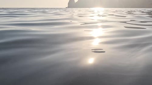 Sea Water Surface Low Angle View Over Clear Azure Sea Water Sun Glare Abstract Nautical Summer Ocean