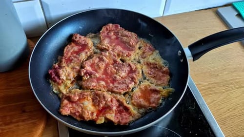 Frying Thinly Sliced Beef in a Pan - Close Up