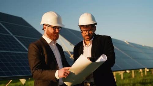 Investors Discussing Plans at Solar Farm